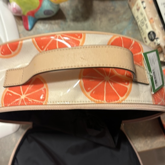 Kate Spade 11” clutch NWT. The only flaw is a small water mark under plastic. - Picture 8 of 16